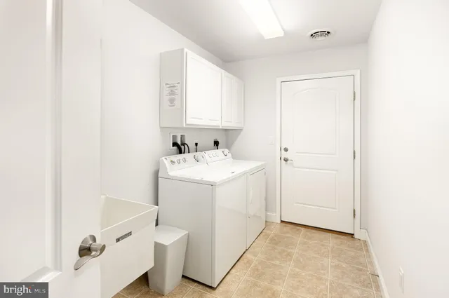 a bathroom with a sink a mirror and a shower