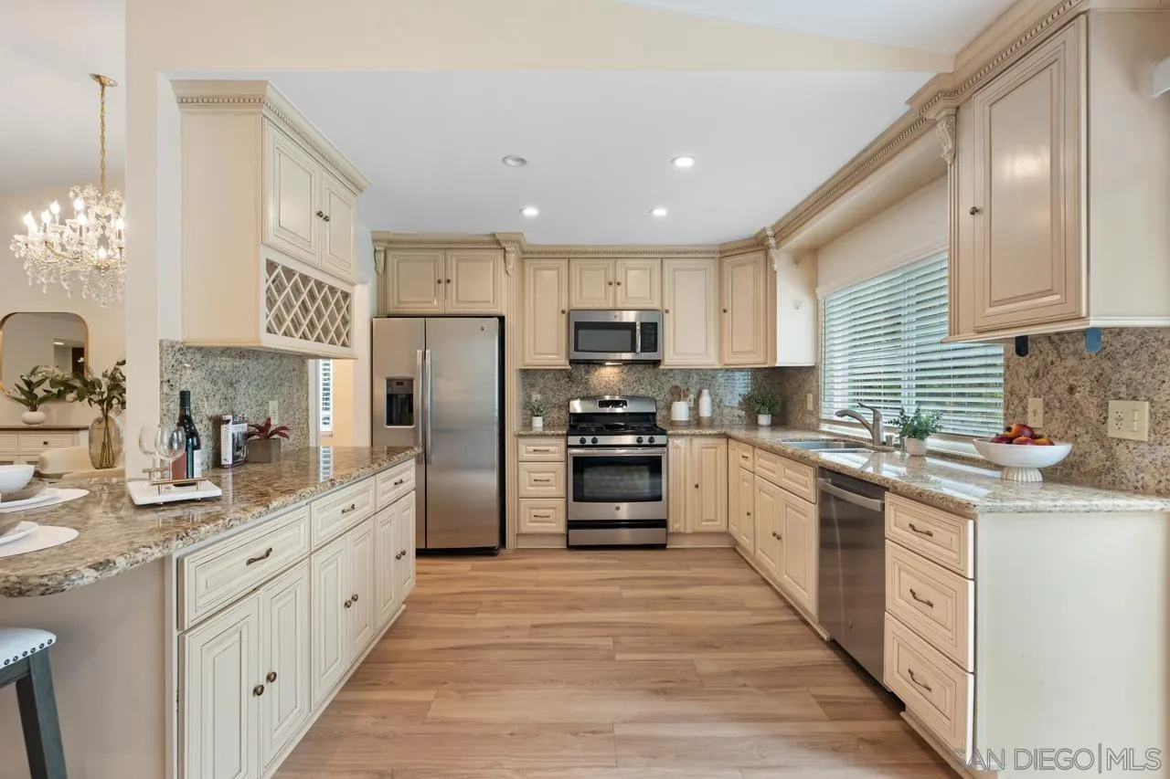 11837 La Colina Road San Diego, CA 92131 - Photo 14 of 35 a large kitchen with stainless steel appliances lots of counter space sink and cabinets
