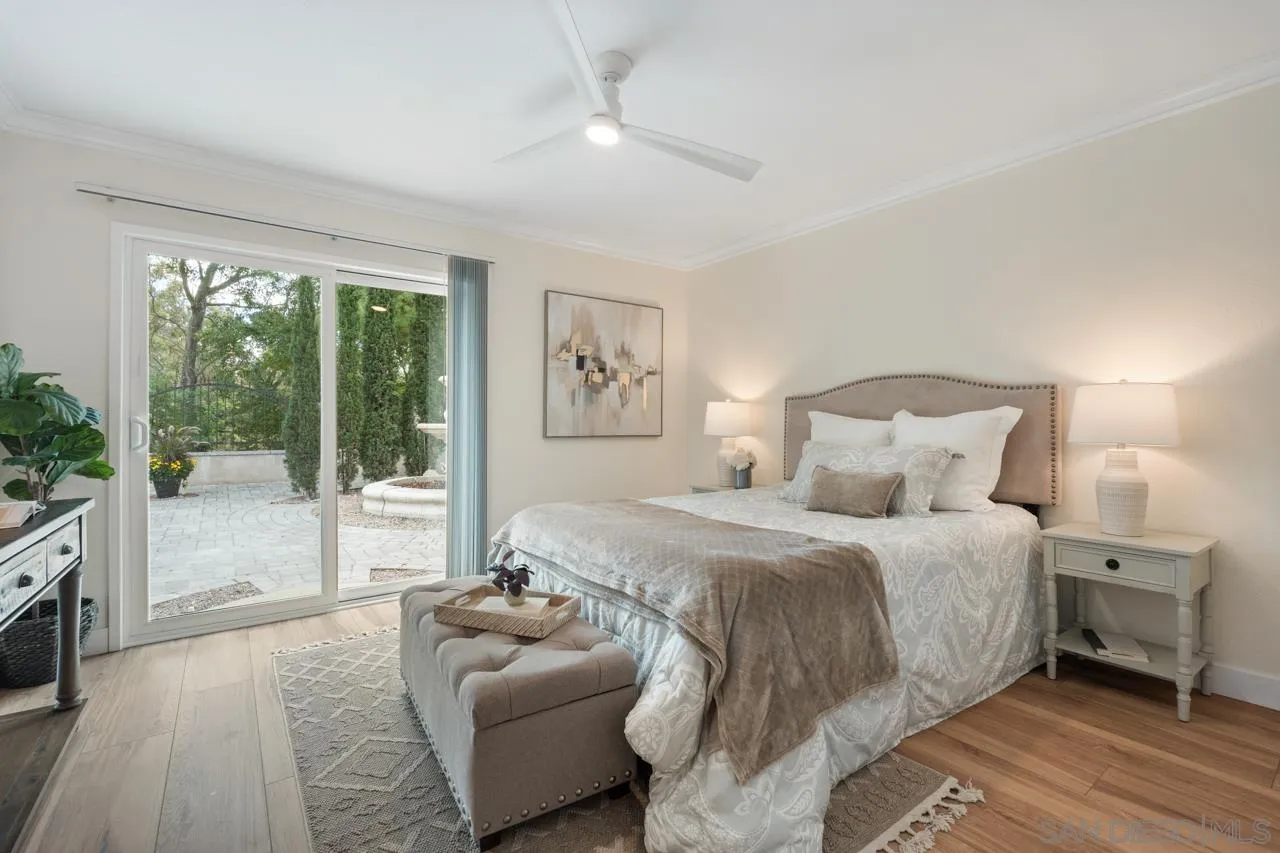 11837 La Colina Road San Diego, CA 92131 - Photo 16 of 35 a spacious bedroom with a bed and a couch