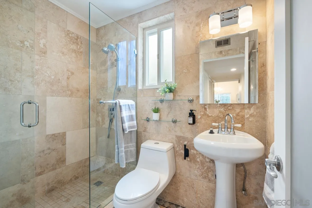 11837 La Colina Road San Diego, CA 92131 - Photo 20 of 35 a bathroom with a sink toilet and shower