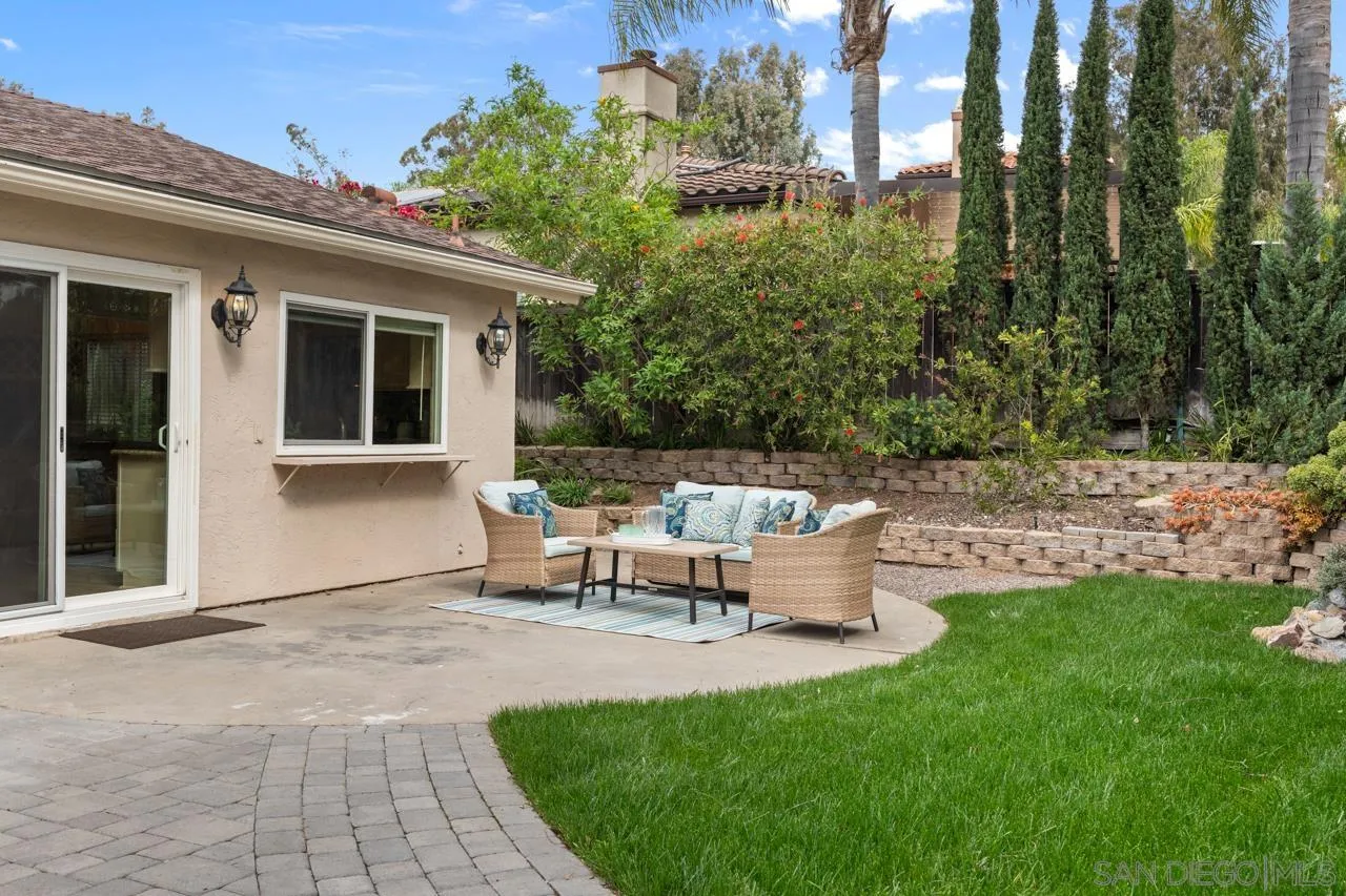 11837 La Colina Road San Diego, CA 92131 - Photo 23 of 35 a view of a house with backyard and sitting area