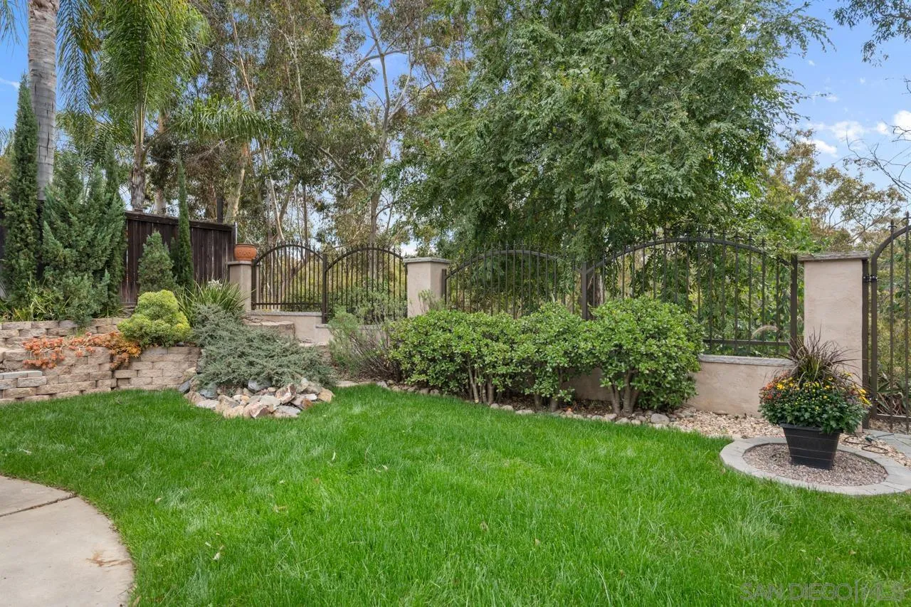 11837 La Colina Road San Diego, CA 92131 - Photo 24 of 35 a view of a garden with a fountain