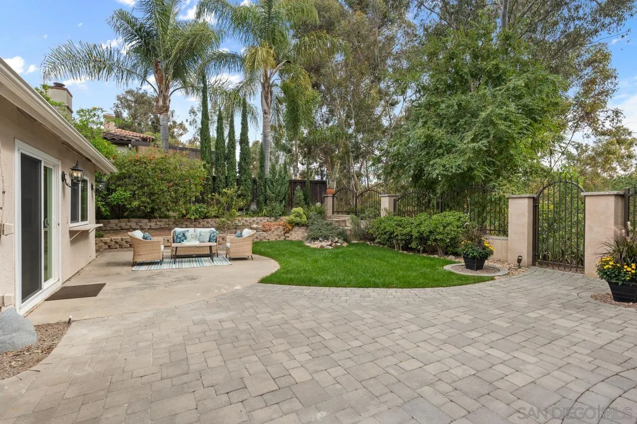 11837 La Colina Road San Diego, CA 92131 - Photo 25 of 35 a view of a patio with couches and a fire pit