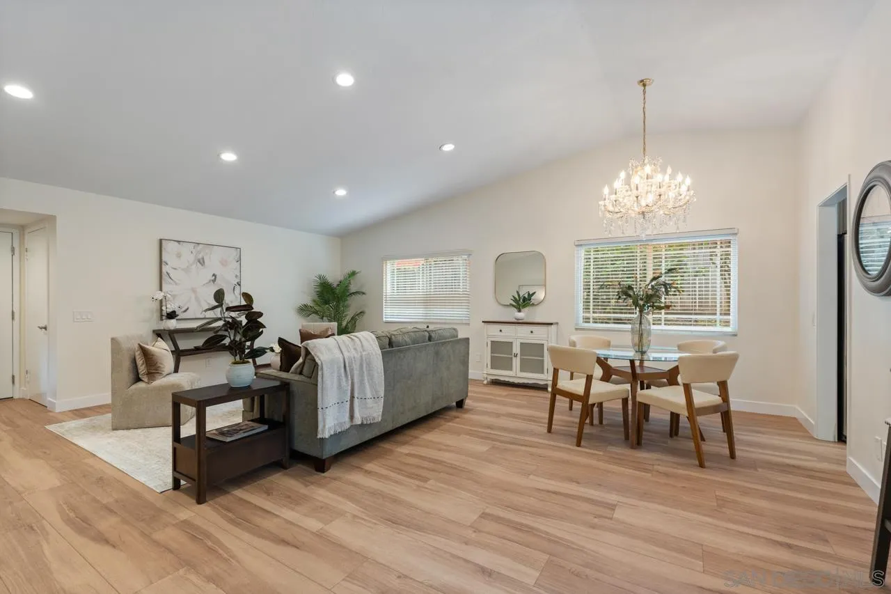 11837 La Colina Road San Diego, CA 92131 - Photo 10 of 35 a living room with furniture and a chandelier