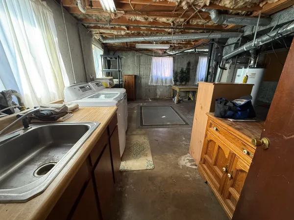 a kitchen with a sink a stove and a refrigerator