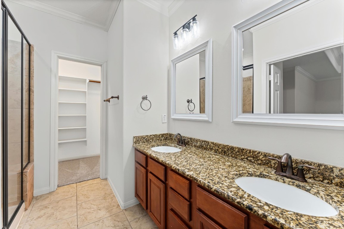 133 East Montfair Boulevard The Woodlands, TX 77382 - Photo 12 of 20 a bathroom with a granite countertop sink and a mirror