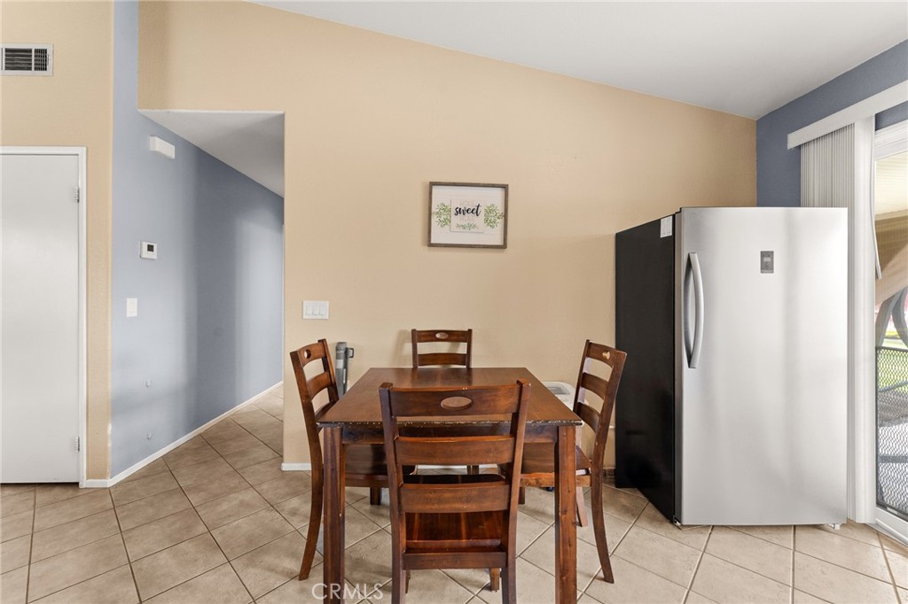 533 Heidi Circle Beaumont, CA 92223 - Photo 12 of 37 a dining room with furniture and refrigerator