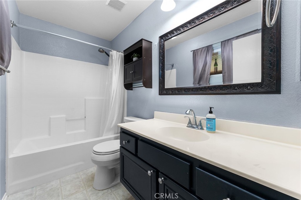 533 Heidi Circle Beaumont, CA 92223 - Photo 21 of 37 a bathroom with a sink a toilet and shower