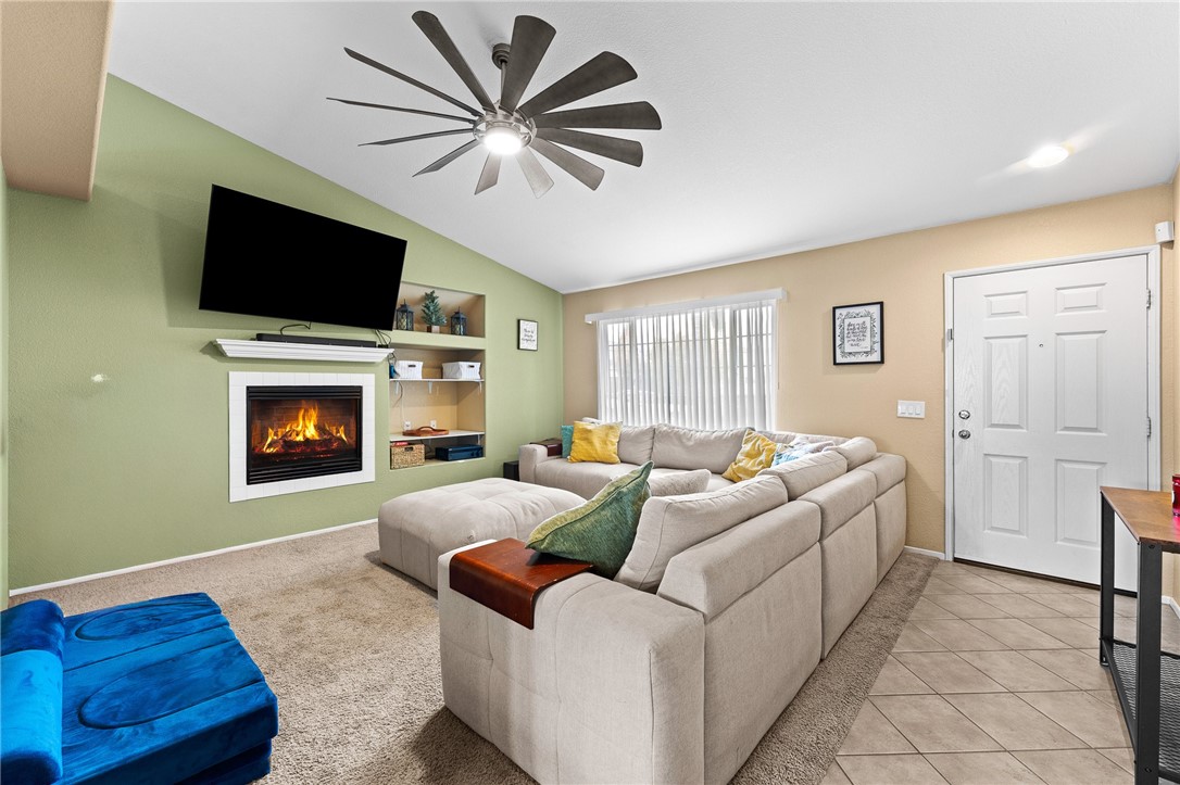 533 Heidi Circle Beaumont, CA 92223 - Photo 6 of 37 a living room with furniture fireplace and flat screen tv