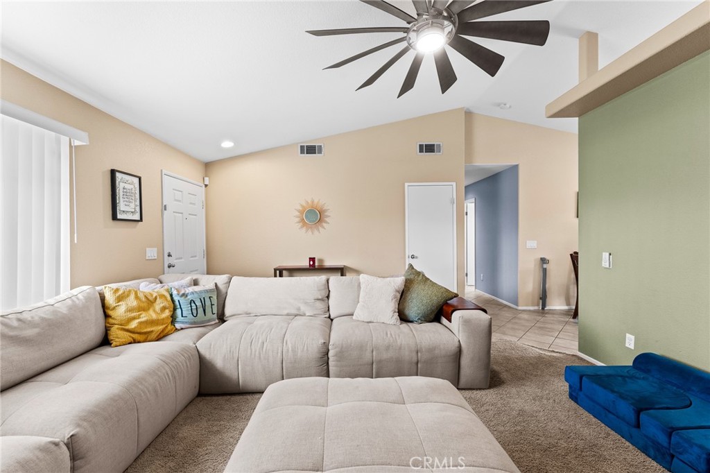 533 Heidi Circle Beaumont, CA 92223 - Photo 7 of 37 a living room with furniture and a ceiling fan