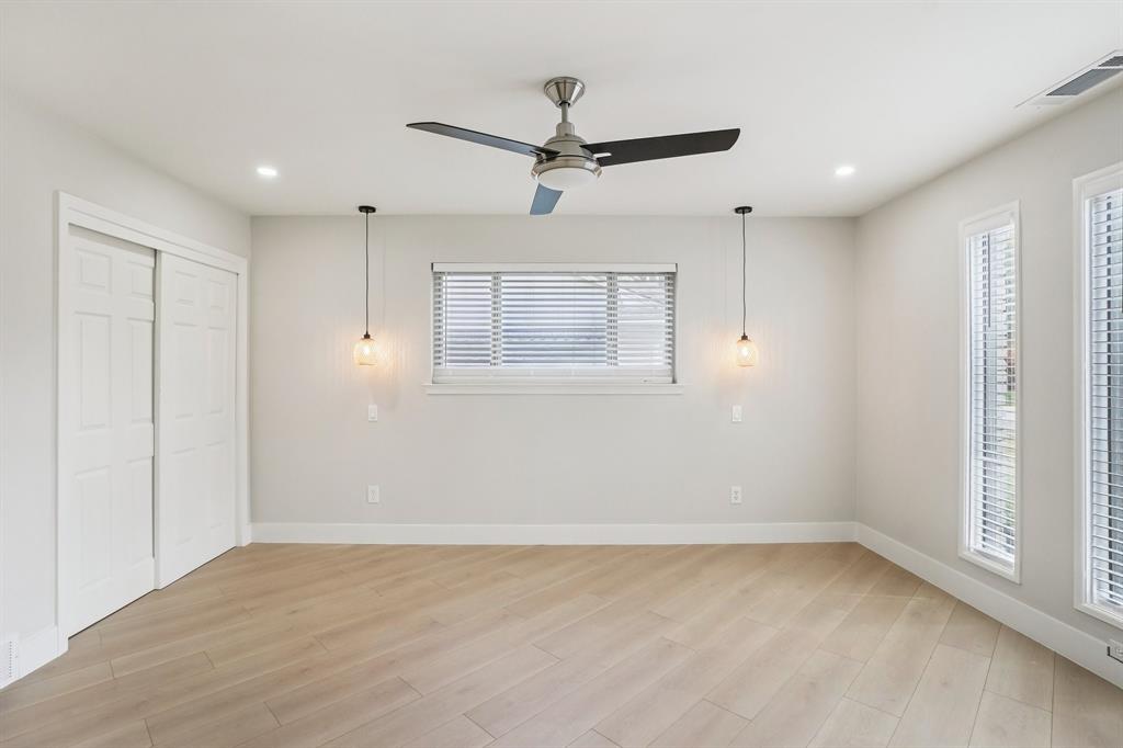 3237 Timberview Road Dallas, TX 75229 - Photo 13 of 30 Primary suite with designer pendant lighting and ceiling fan