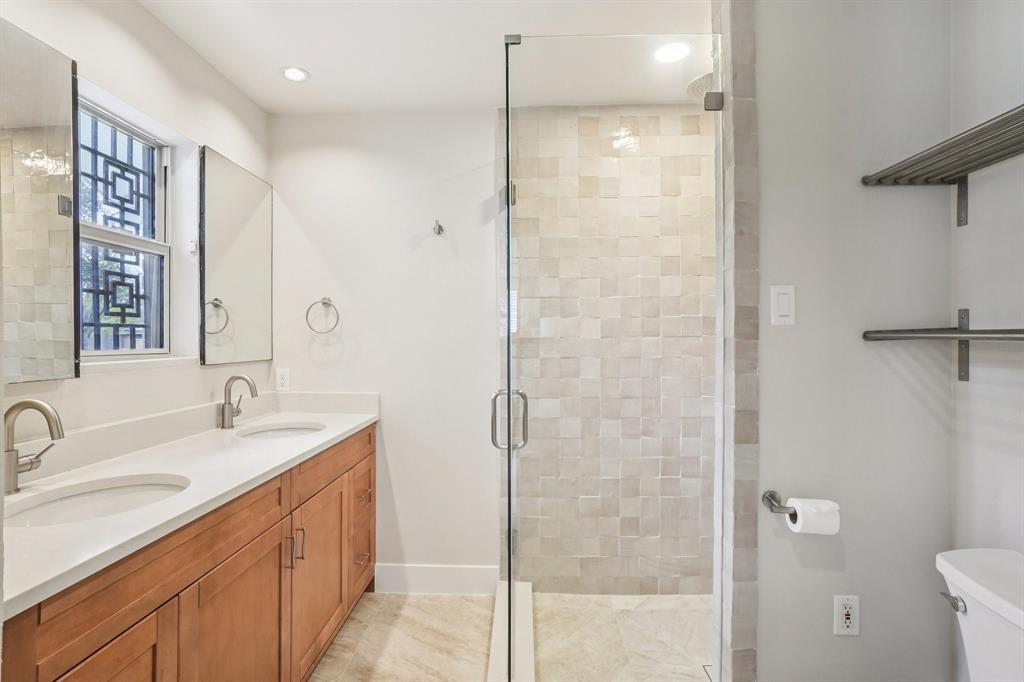 3237 Timberview Road Dallas, TX 75229 - Photo 15 of 30 Double vanity and glass-enclosed zellige tile shower