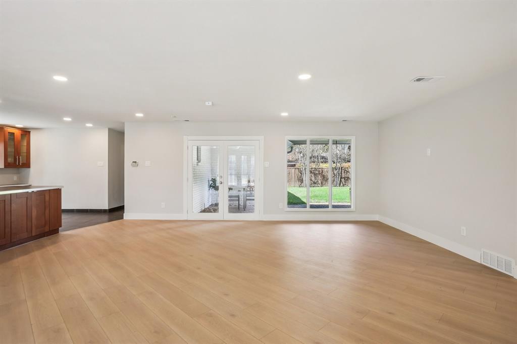 3237 Timberview Road Dallas, TX 75229 - Photo 7 of 30 French doors flood the living area with natural light