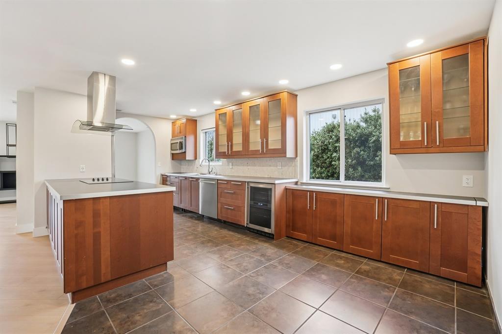 3237 Timberview Road Dallas, TX 75229 - Photo 10 of 30 Oversized kitchen with shaker cabinetry and wine fridge