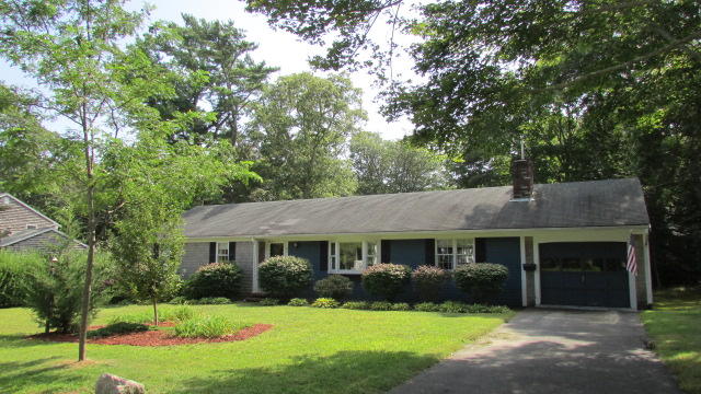43 Chappaquiddick Road Centerville, MA 02632 - Photo 1 of 8 a view of a house with yard and a garden