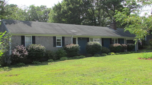 43 Chappaquiddick Road Centerville, MA 02632 - Photo 2 of 8 a front view of house with yard and green space