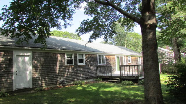 43 Chappaquiddick Road Centerville, MA 02632 - Photo 3 of 8 a view of front of a house with a yard