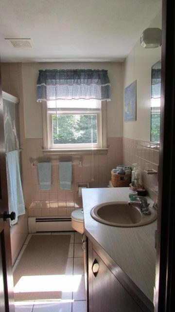 43 Chappaquiddick Road Centerville, MA 02632 - Photo 6 of 8 a bathroom with a sink and a bathtub