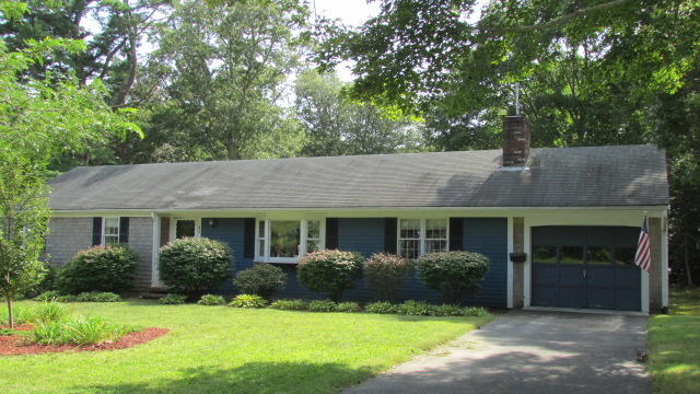 43 Chappaquiddick Road Centerville, MA 02632 - Photo 8 of 8 a front view of a house with a yard and garage