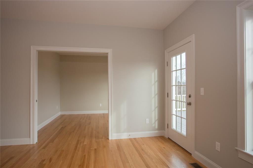 82 Wyman Way Cumberland Center, ME 04021 - Photo 14 of 28 French door to deck and den