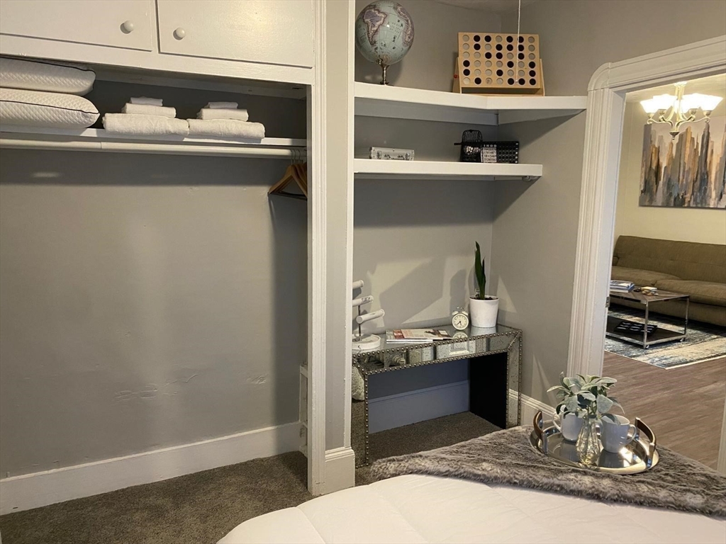 9 Henry Street, Unit 2 Everett, MA 02149 - Photo 14 of 19 a bathroom with a sink and a mirror