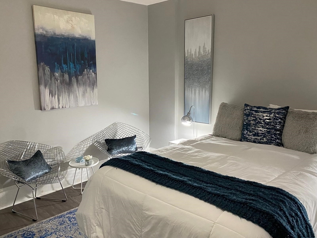 9 Henry Street, Unit 2 Everett, MA 02149 - Photo 15 of 19 a bedroom with a bed and window