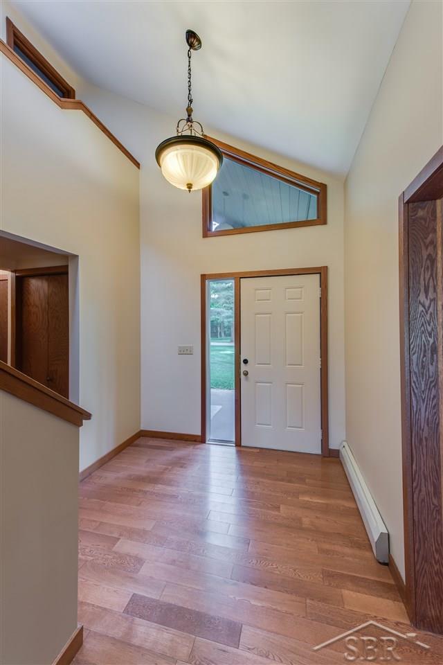 3201 Pomranky Road Midland, MI 48640 - Photo 2 of 29 Your guests will feel at home when they enter through the front door into this inviting foyer with two-story ceilings.