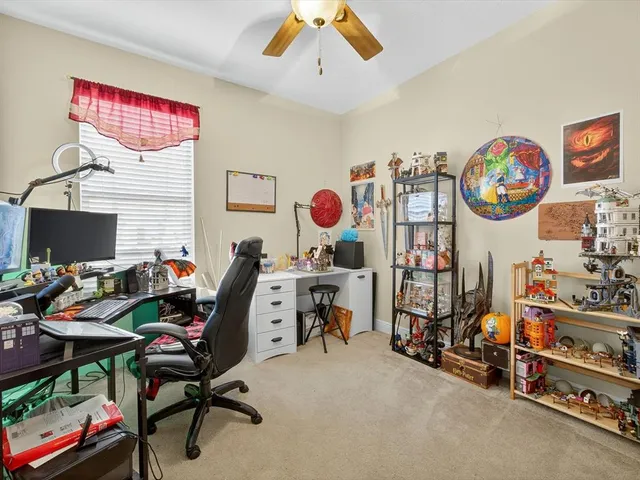 a view of a workspace with furniture