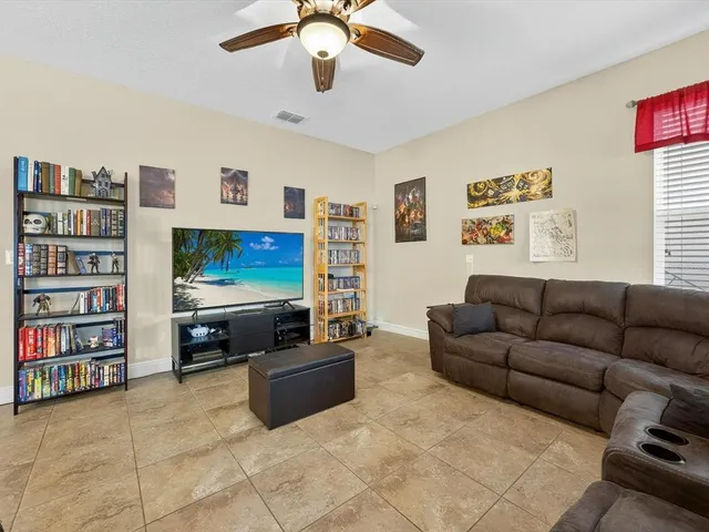 a living room with furniture workspace and a window