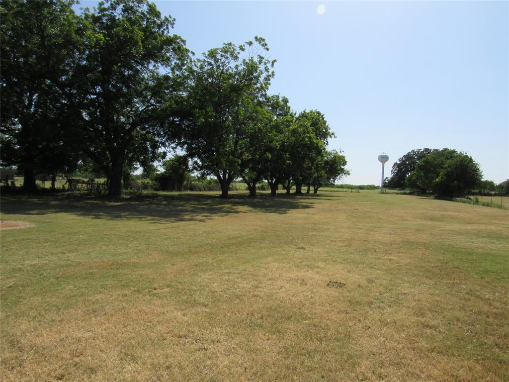 a view of outdoor space with deck and yard