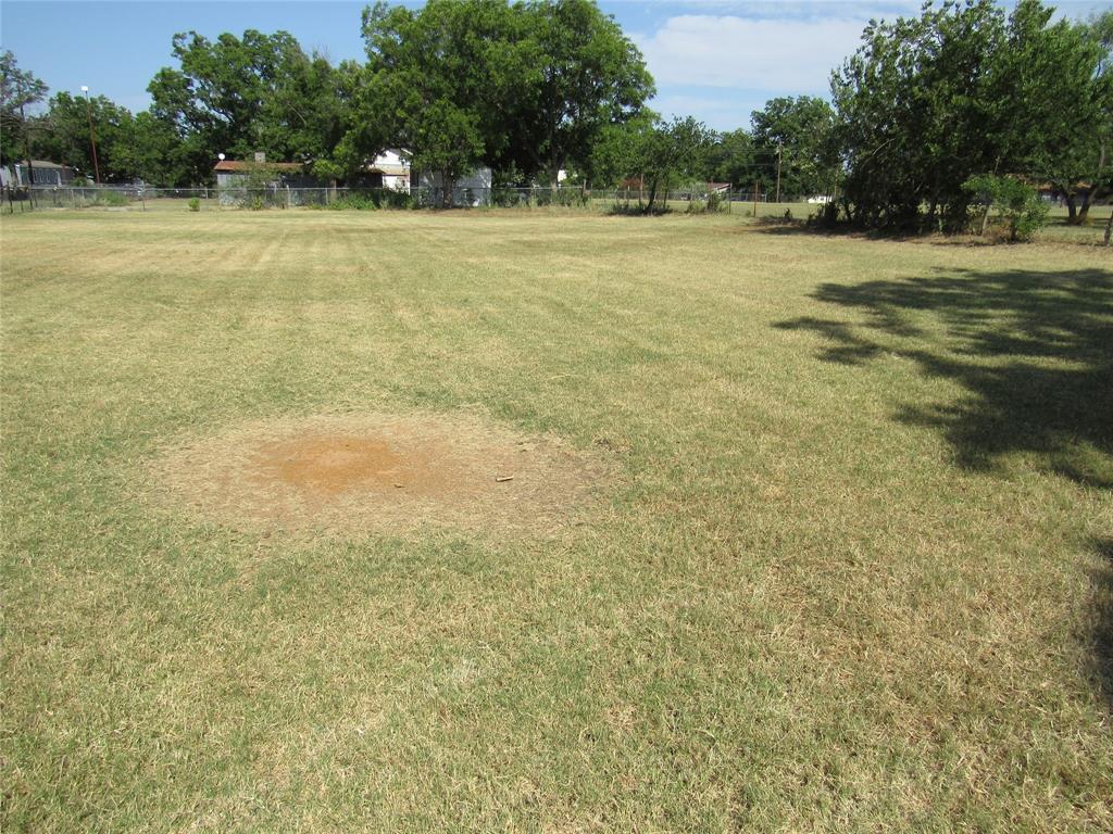 0 Tbd Street Bangs, TX 76823 - Photo 3 of 5 a view of a tennis court with trees in the background