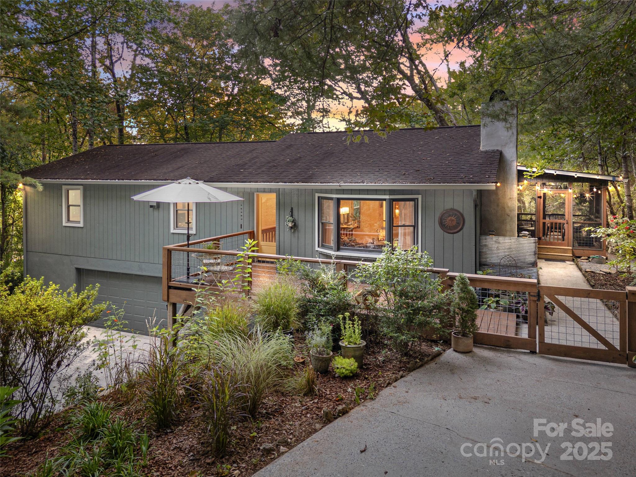 197 Tiptop Road Brevard, NC 28712 - Photo 1 of 45 front view of house with a yard