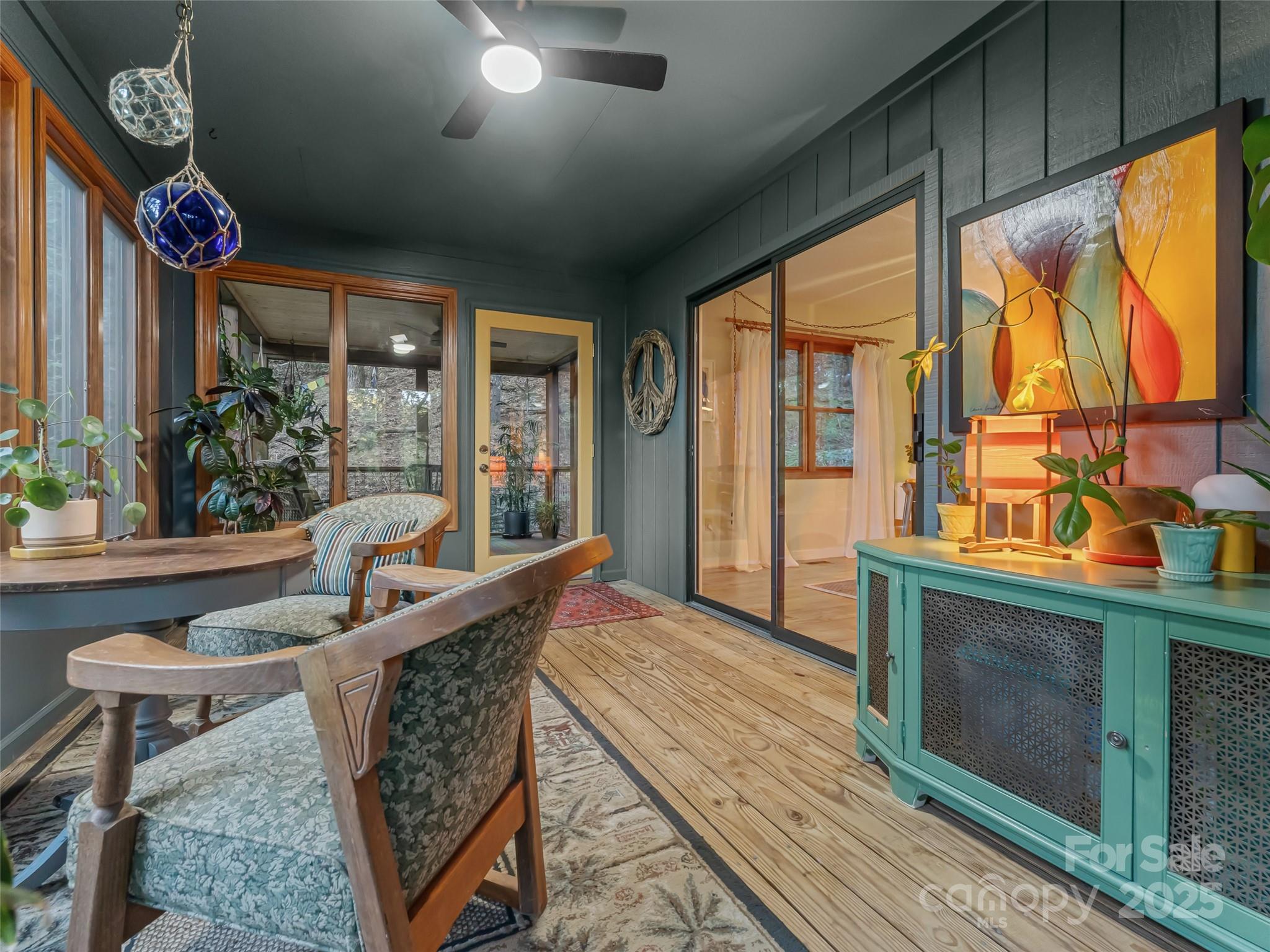 197 Tiptop Road Brevard, NC 28712 - Photo 15 of 45 a living room with furniture a window and a fireplace