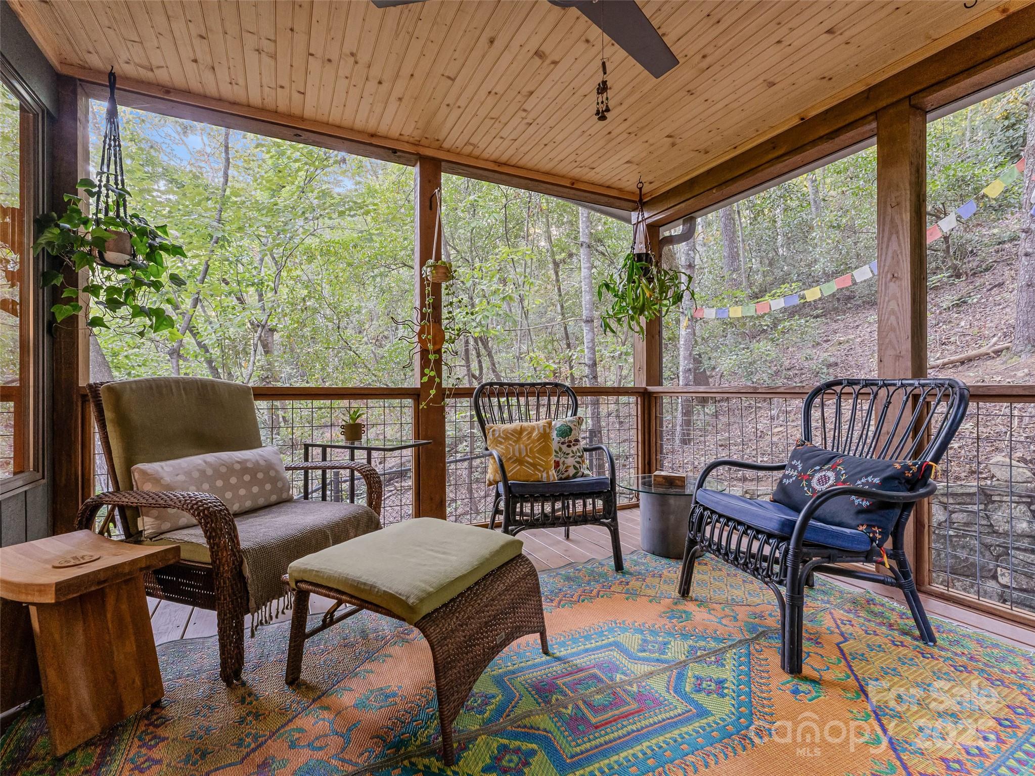 197 Tiptop Road Brevard, NC 28712 - Photo 16 of 45 a balcony with furniture and a potted plant