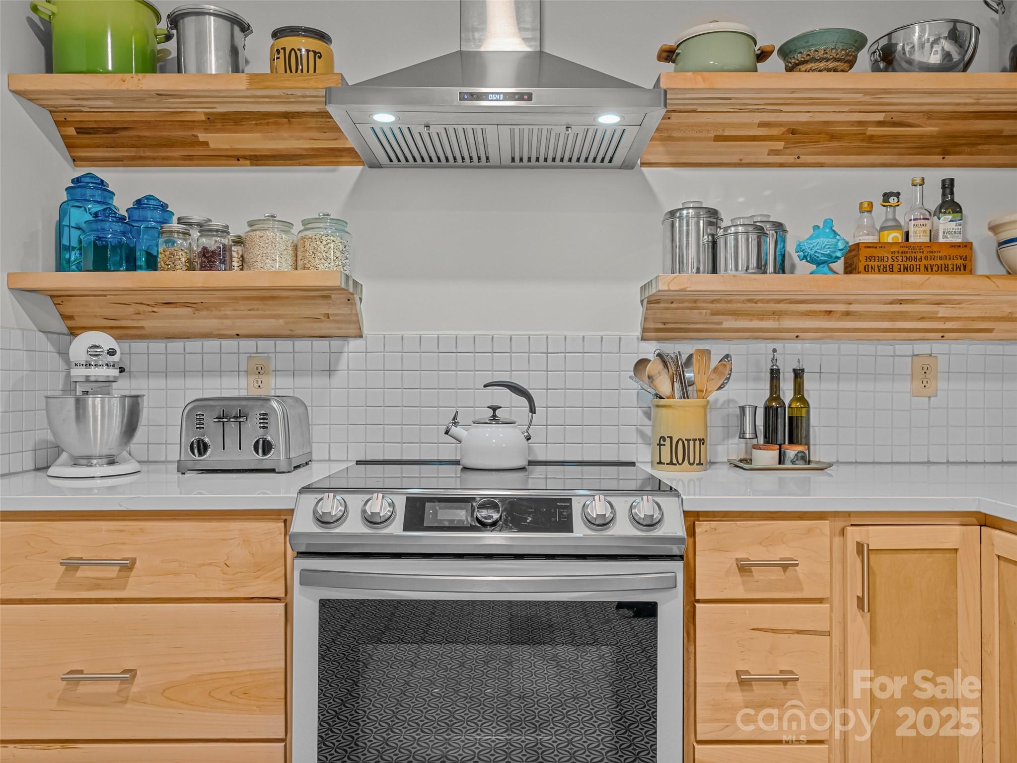 197 Tiptop Road Brevard, NC 28712 - Photo 20 of 45 a stove top oven sitting inside of a kitchen
