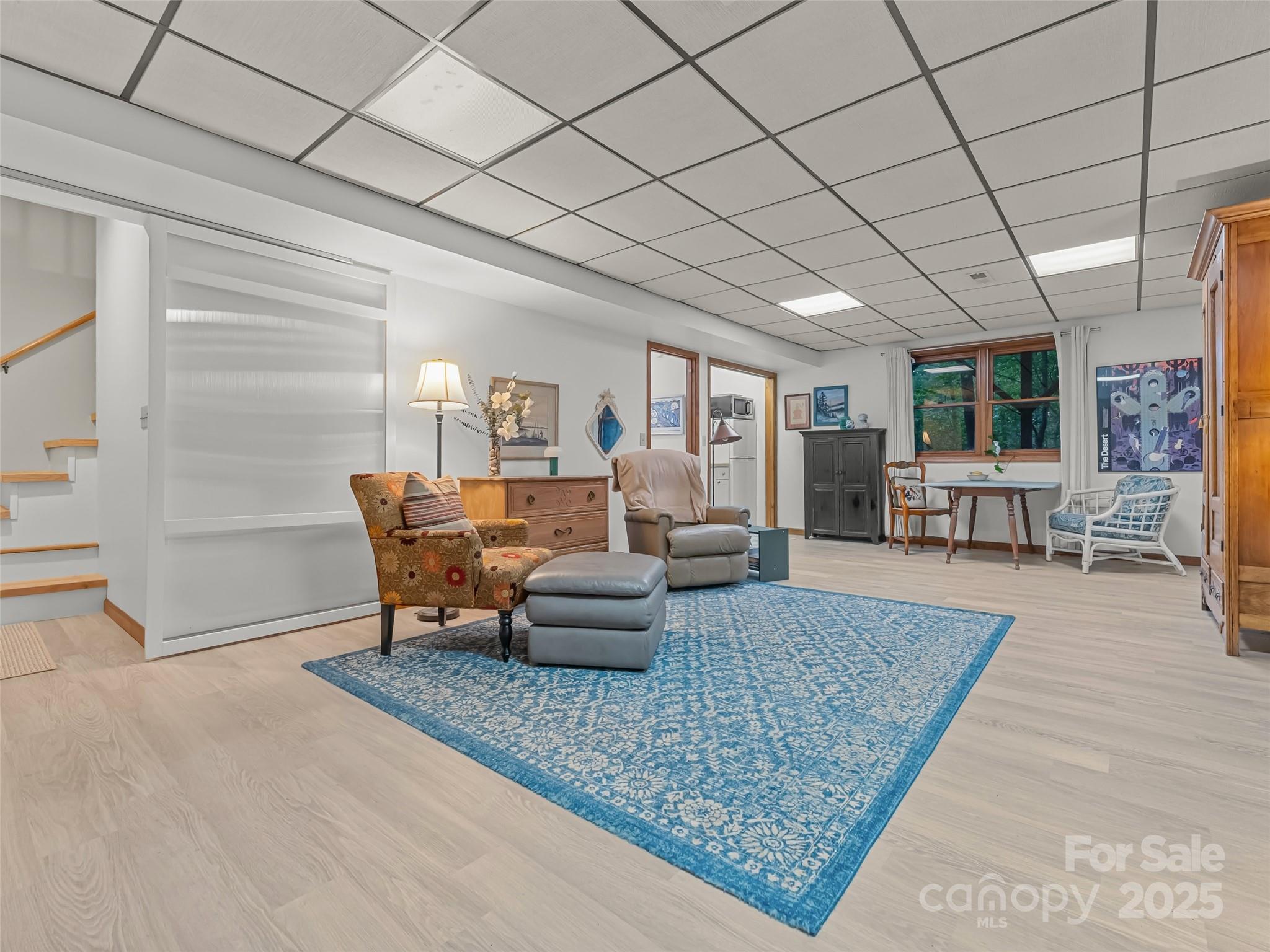 197 Tiptop Road Brevard, NC 28712 - Photo 29 of 45 a living room with furniture rug and wooden floor