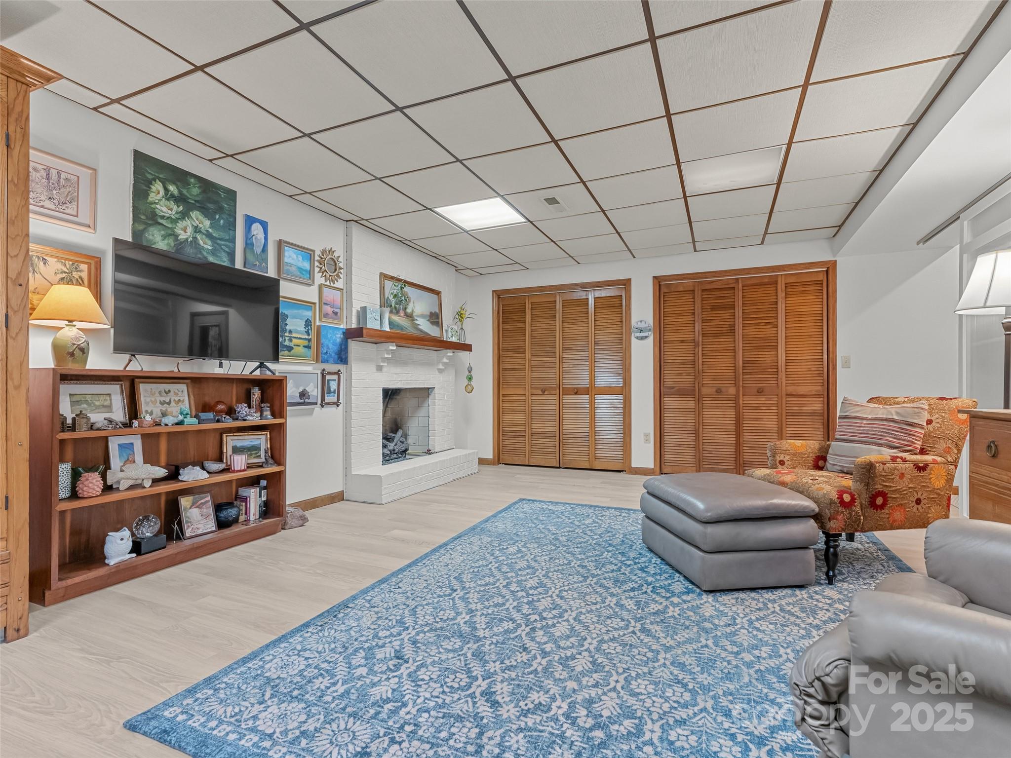 197 Tiptop Road Brevard, NC 28712 - Photo 31 of 45 a living room with furniture and a flat screen tv
