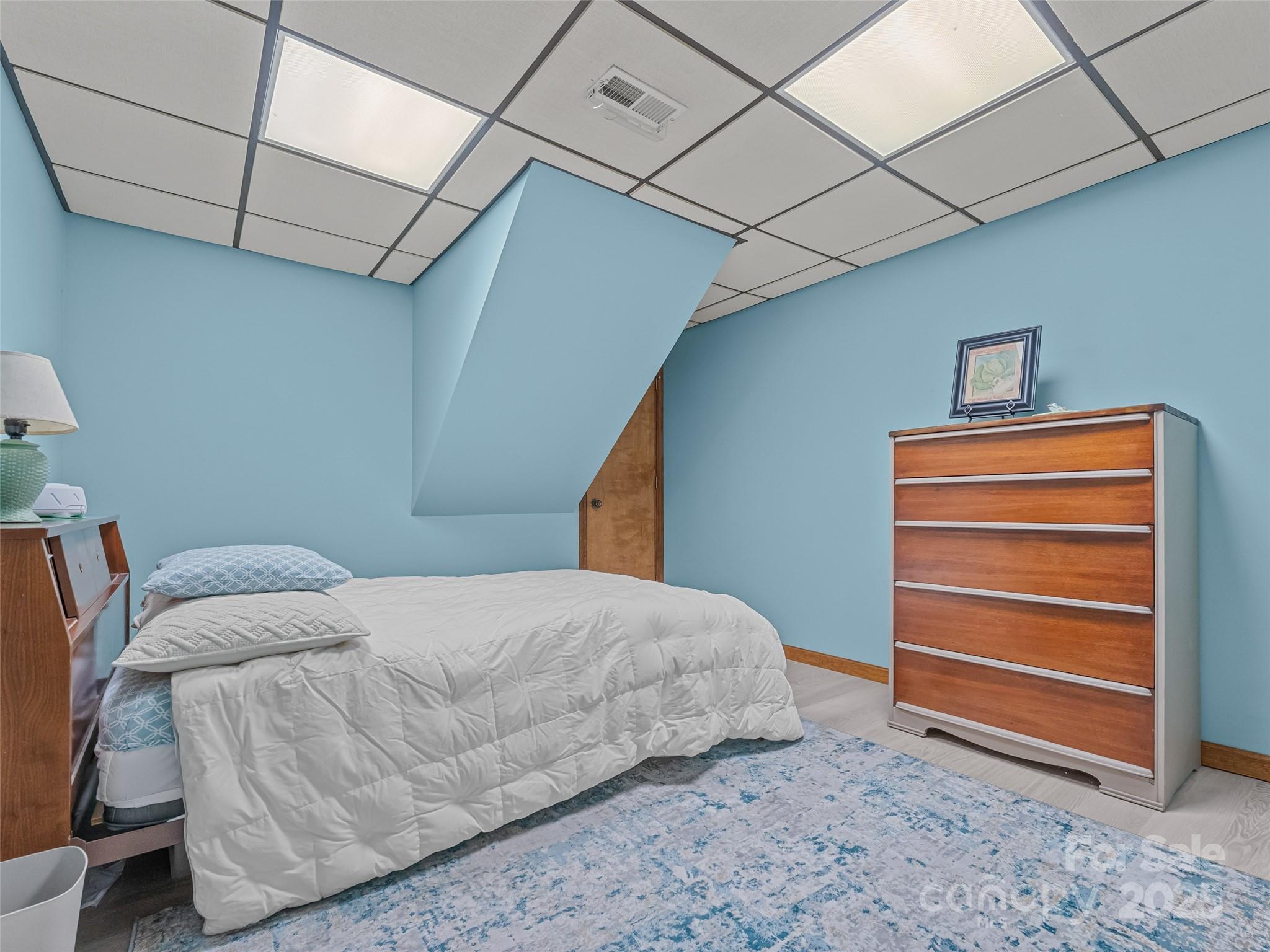 197 Tiptop Road Brevard, NC 28712 - Photo 35 of 45 a bedroom with a bed and a cabinets