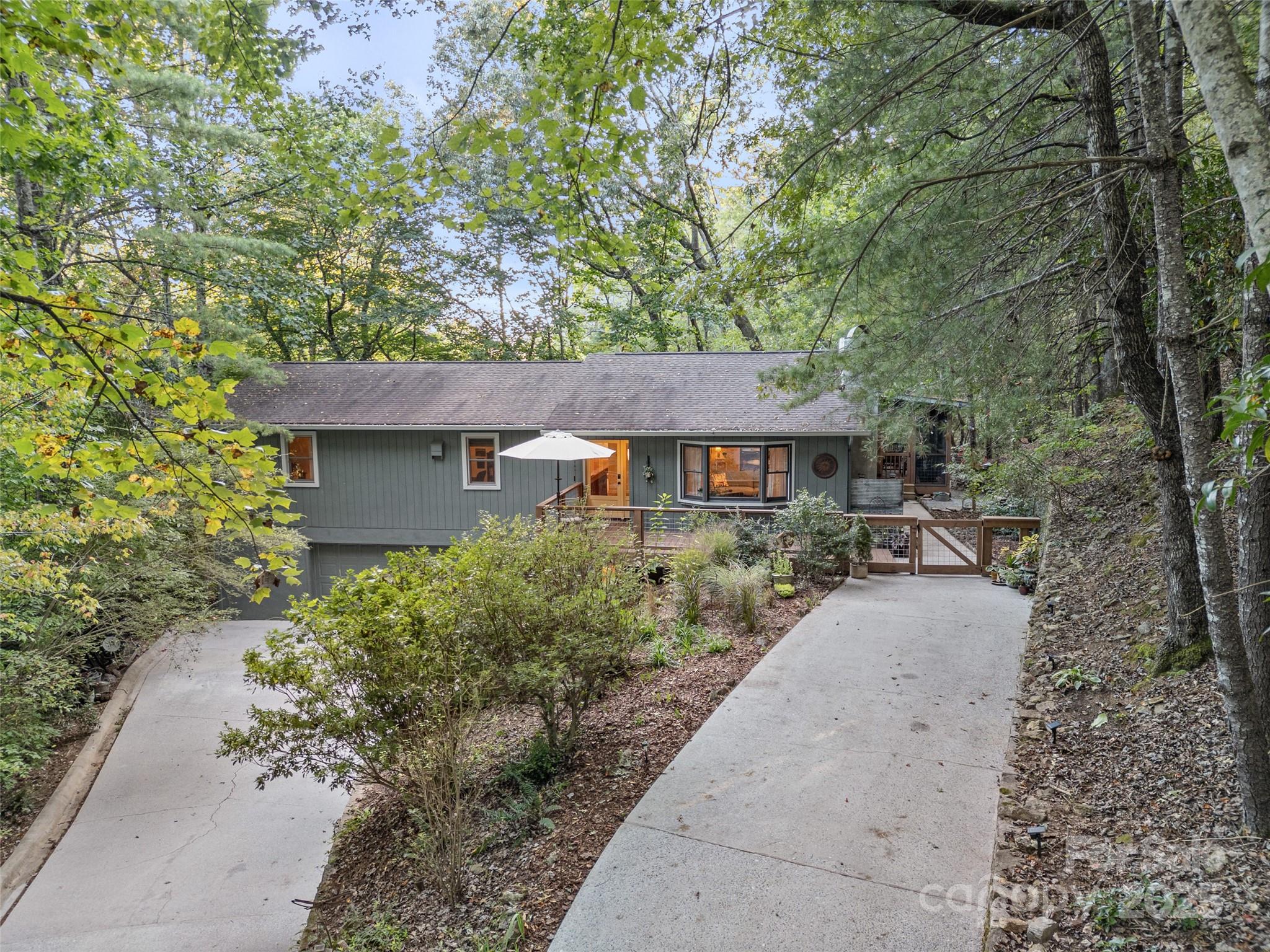 197 Tiptop Road Brevard, NC 28712 - Photo 37 of 45 front view of a house with a yard