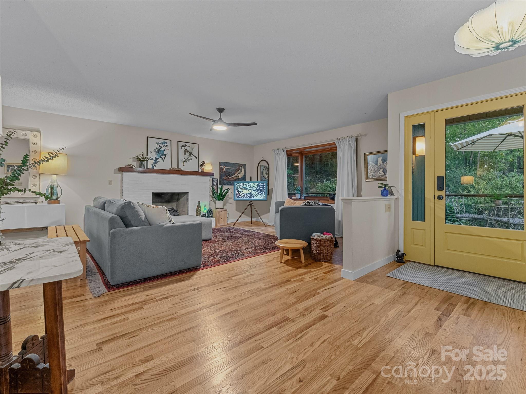 197 Tiptop Road Brevard, NC 28712 - Photo 5 of 45 a living room with furniture and a wooden floor