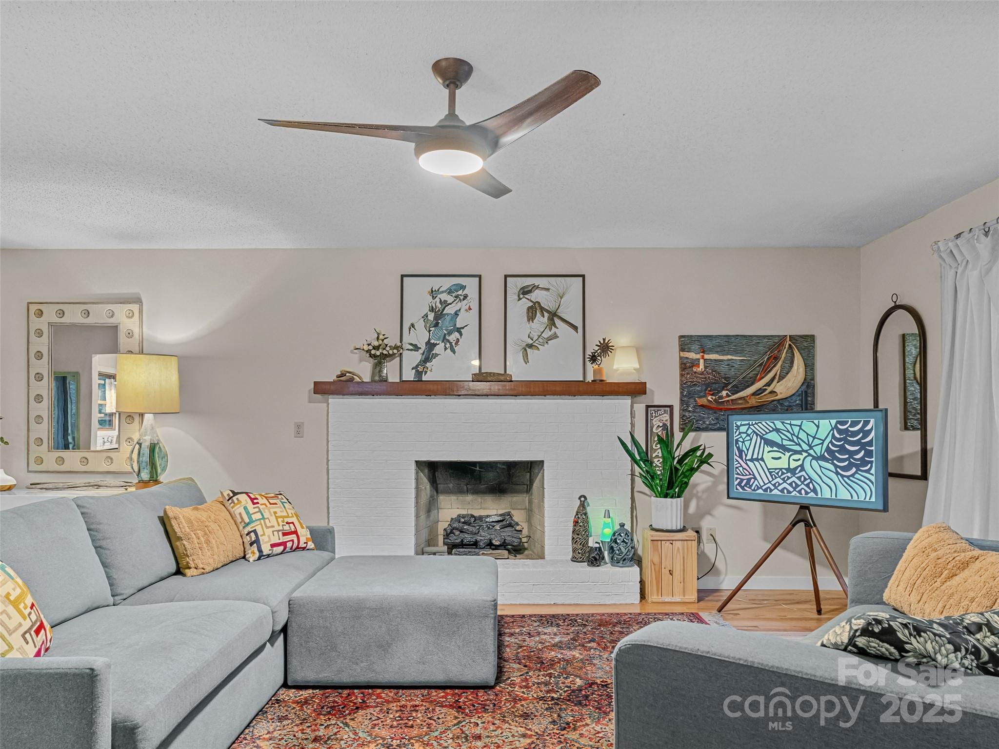 197 Tiptop Road Brevard, NC 28712 - Photo 7 of 45 a living room with furniture and a fireplace