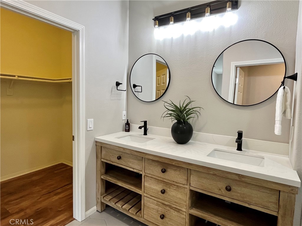 60 Strawflower Street Ladera Ranch, CA 92694 - Photo 12 of 22 a bathroom with a sink and a mirror
