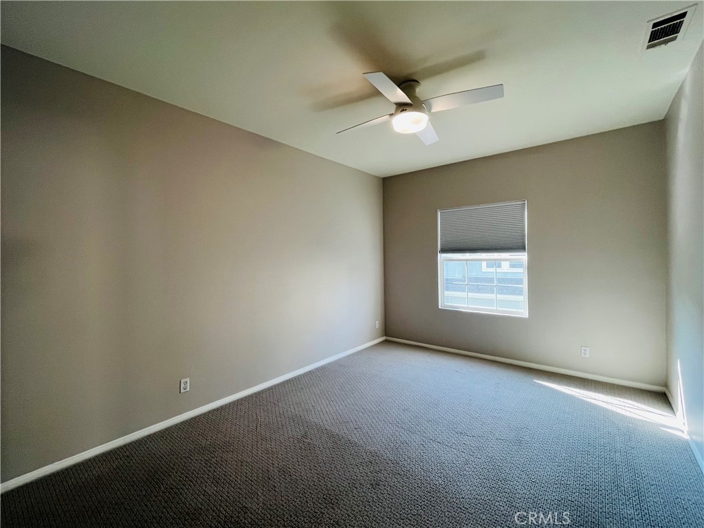 60 Strawflower Street Ladera Ranch, CA 92694 - Photo 15 of 22 an empty room with a window and a fan