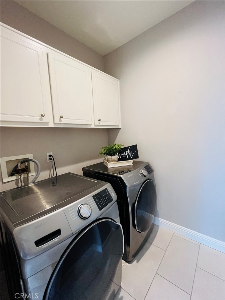 60 Strawflower Street Ladera Ranch, CA 92694 - Photo 18 of 22 a utility room with dryer and washer