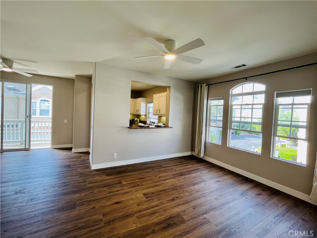 60 Strawflower Street Ladera Ranch, CA 92694 - Photo 9 of 22 a view of an empty room with window and wooden floor