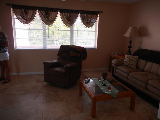285 Norwich L West Palm Beach, FL 33417 - Photo 4 of 17 a living room with furniture and a window