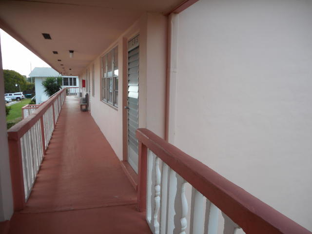 285 Norwich L West Palm Beach, FL 33417 - Photo 9 of 17 a view of a hallway with wooden floor
