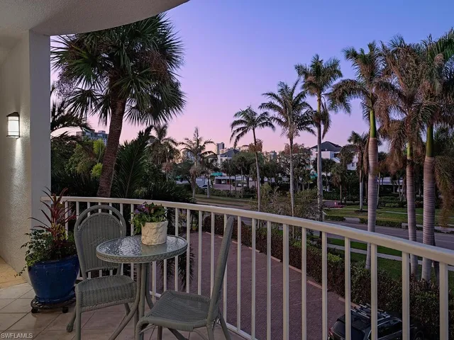a view of a chair and table in patio