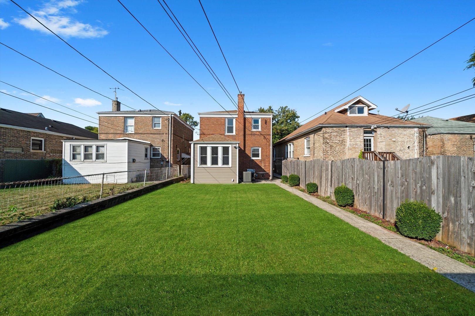 10047 South Calumet Avenue Chicago, IL 60628 - Photo 2 of 32 a view of a back yard of the house