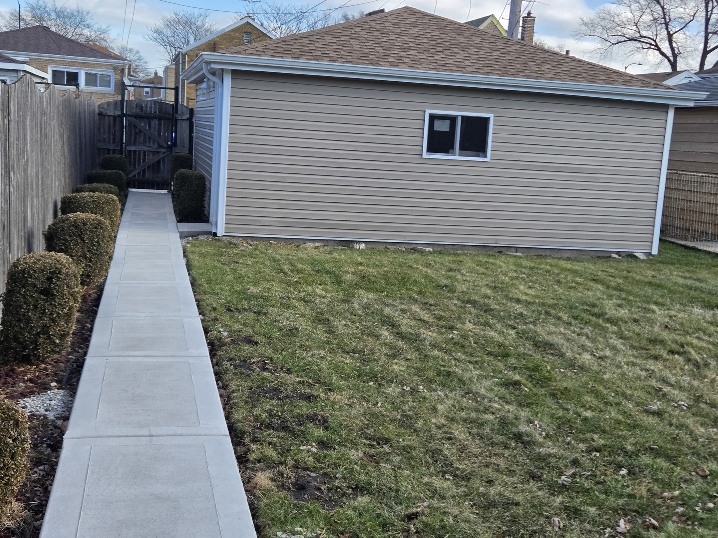 10047 South Calumet Avenue Chicago, IL 60628 - Photo 29 of 32 a view of a backyard